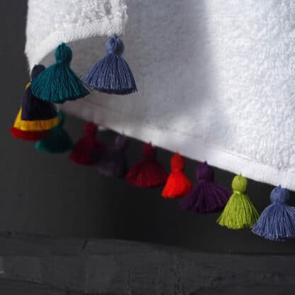 LAMU pompoms Sol hand embroidered on white guest towel