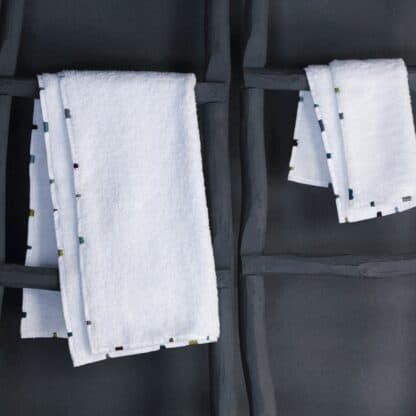Hand-embroidered white bath linen
