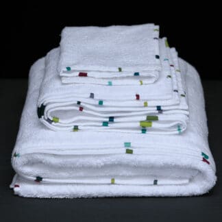 hand embroidered terry Memba bath linen folded