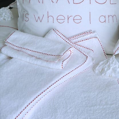 Running stitch hand-embroidered bath linen