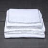 buy white thick terry towel with black hand embroidery