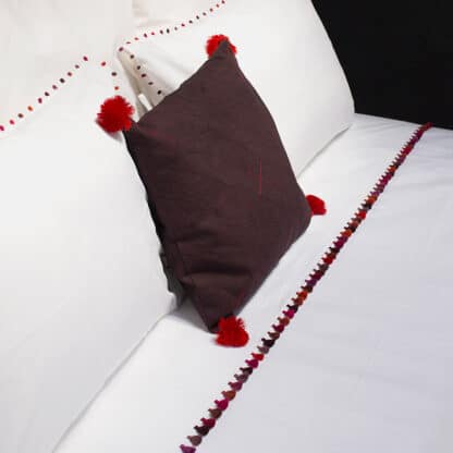 High end white cotton bed sheet with handmade pompoms