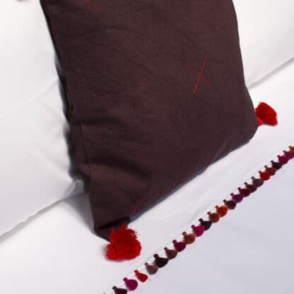 Luxury bed linen with hand-embroidery and pompoms