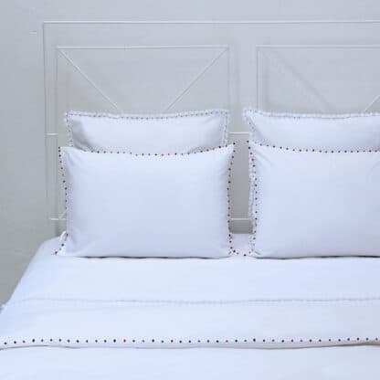 luxury white bed linen with hand embroidery