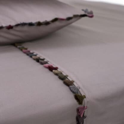 refined grey duvet cover with tassels