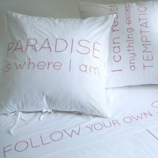 hand-embroidered bed linen with quotes