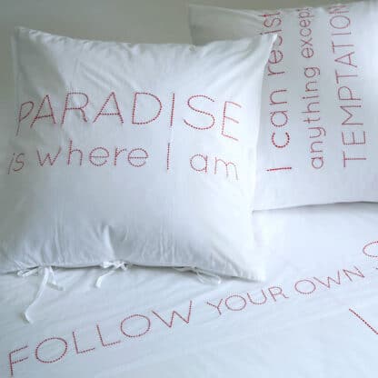 hand-embroidered bed linen with quotes