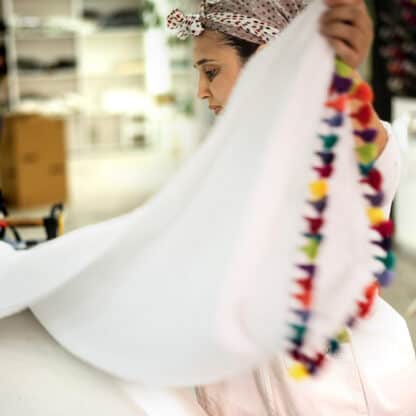 timeless bed sheet with handmade pompoms