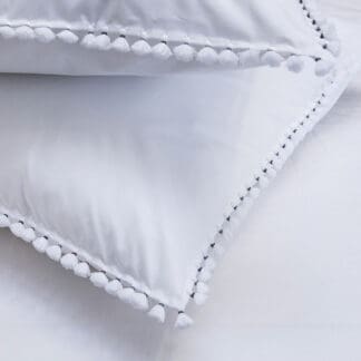 buy white bed linen with white pompoms