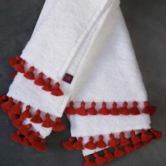 White thick bath linen with hand embroidered red pompoms: LAMU Red