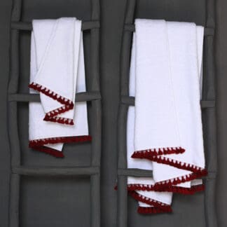White terry towels with tassels: LAMU Carmine bed linen by V. Barkowski