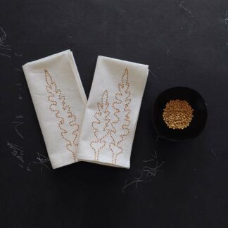 Pair off hand embroidered napkins on ecru cotton