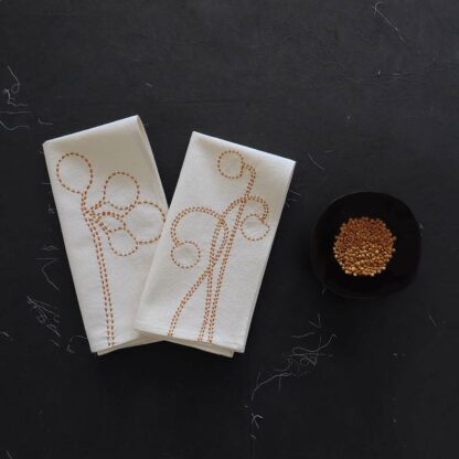 Pair off hand embroidered napkins on ecru cotton