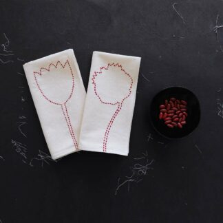 Pair off hand embroidered napkins on ecru cotton